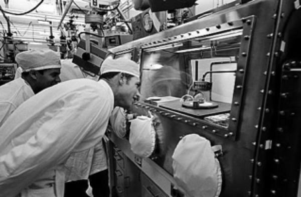 Apollo 15 astronaut Dave Scott examines the Genesis rock